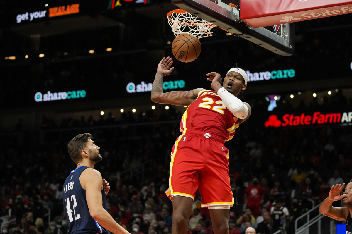 Atlanta Hawks forward Cam Reddish (22) dunks behind Dallas Mavericks forward Maxi Kleber (42) during the second half at State Farm Arena.